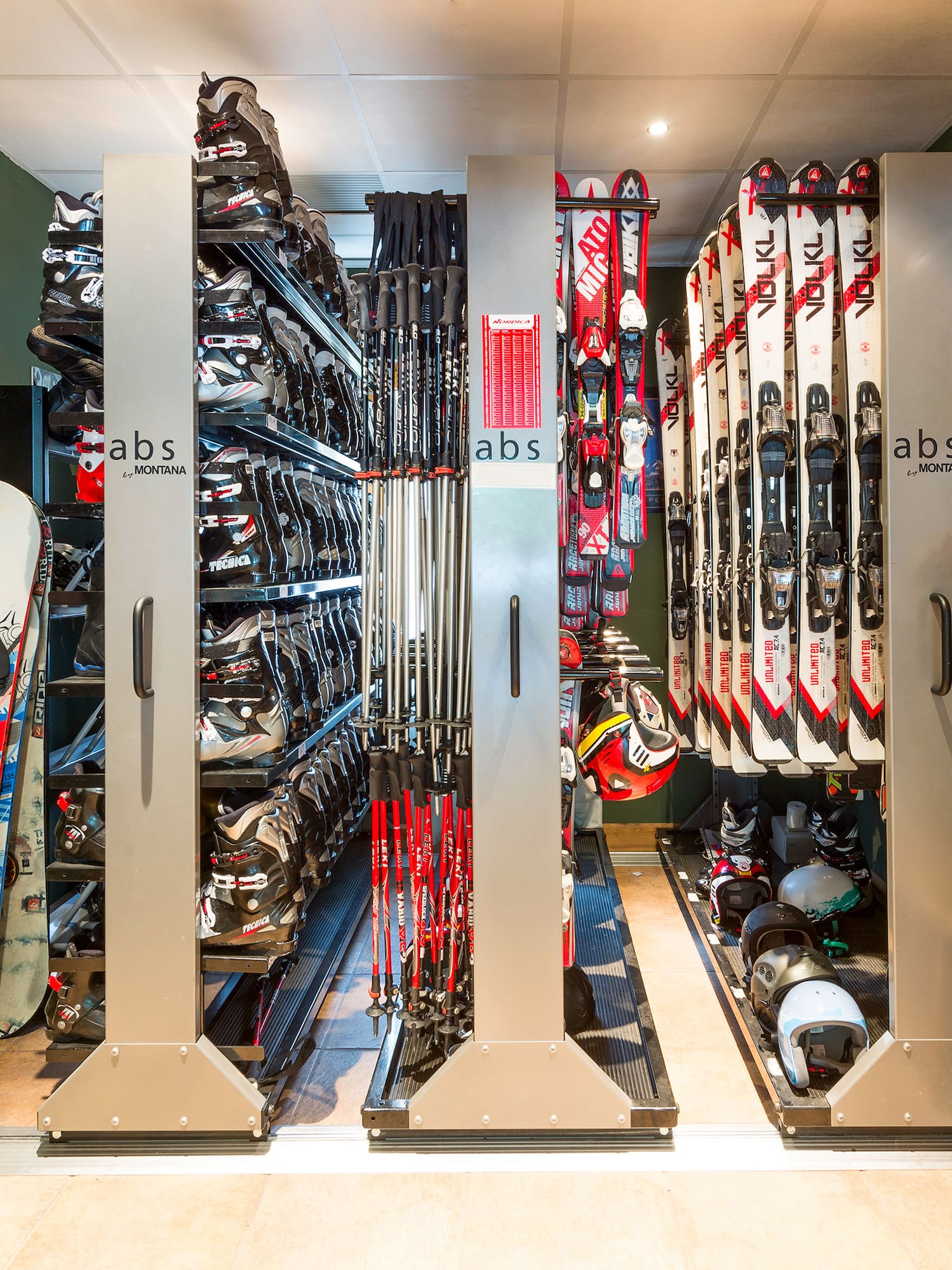a room with snowboards and helmets