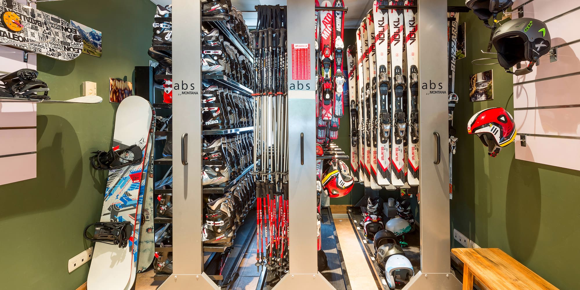 a room with snowboards and helmets
