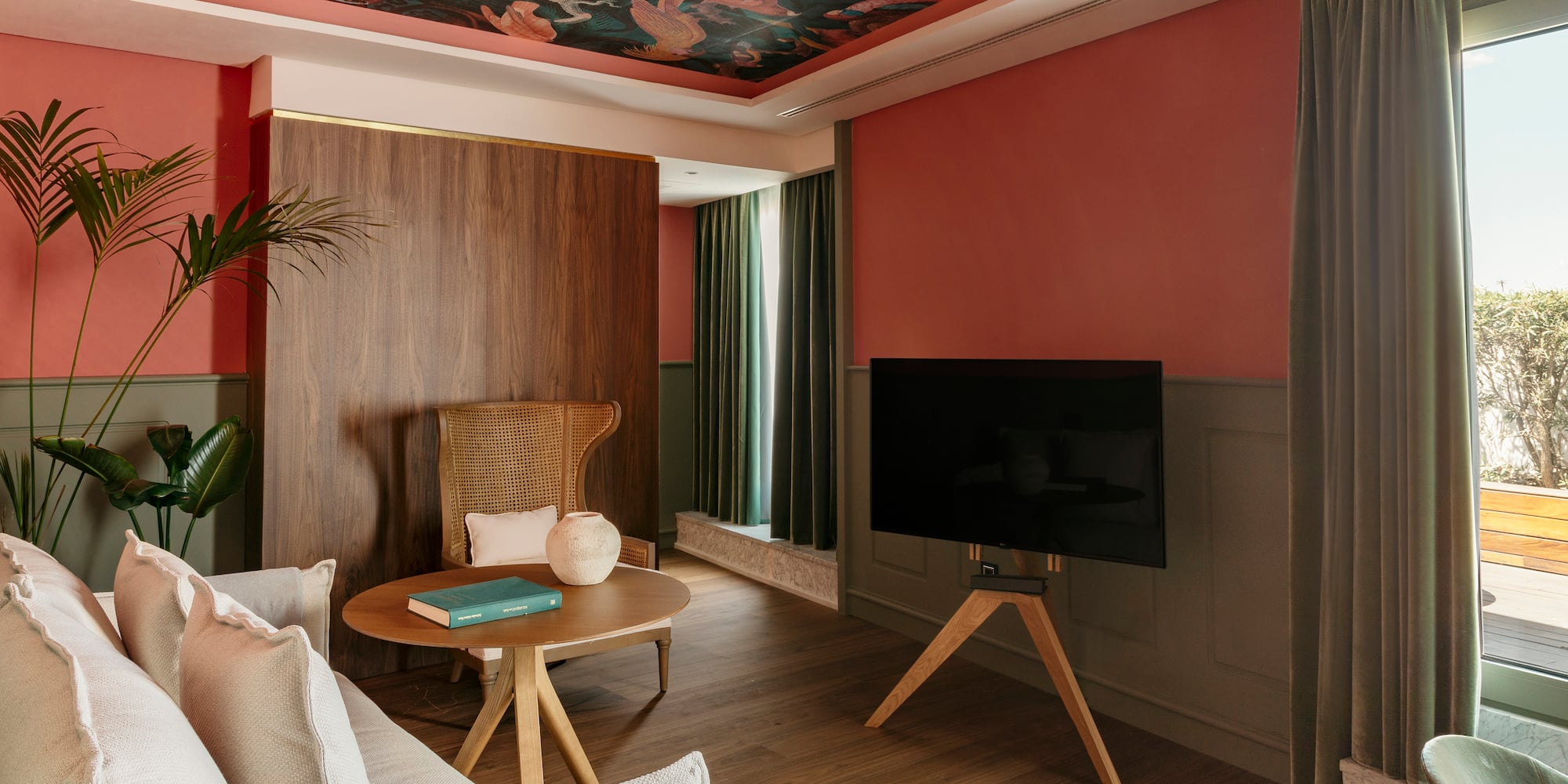 a living room with a tv and a table