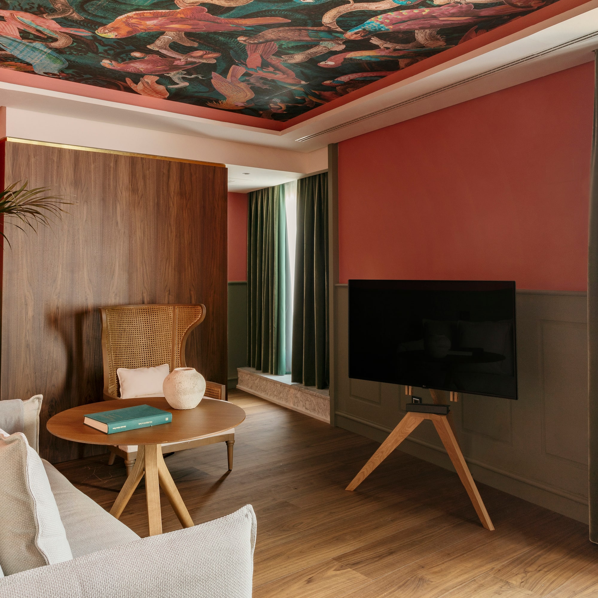 a living room with a tv and a table