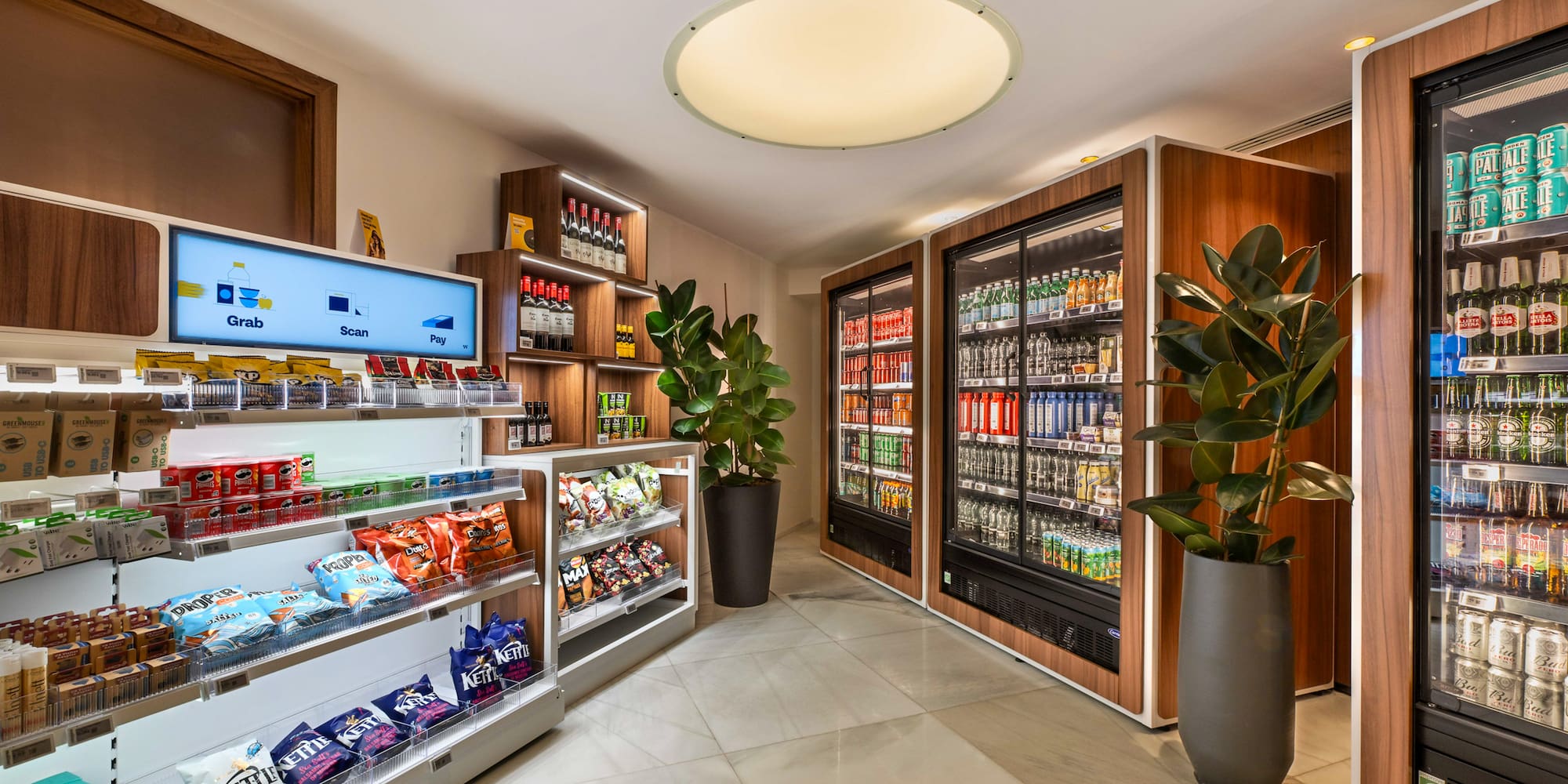 a room with shelves of snacks and a plant