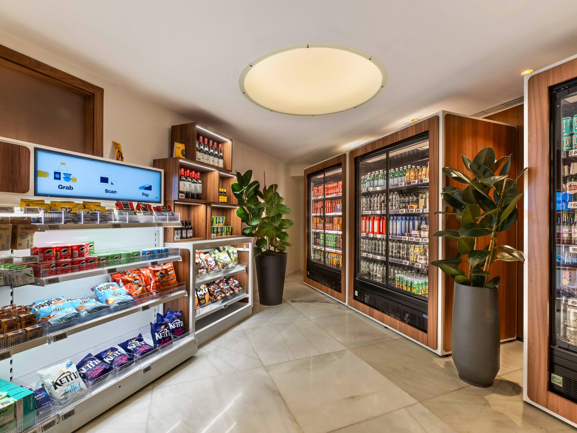 a room with shelves of snacks and a plant
