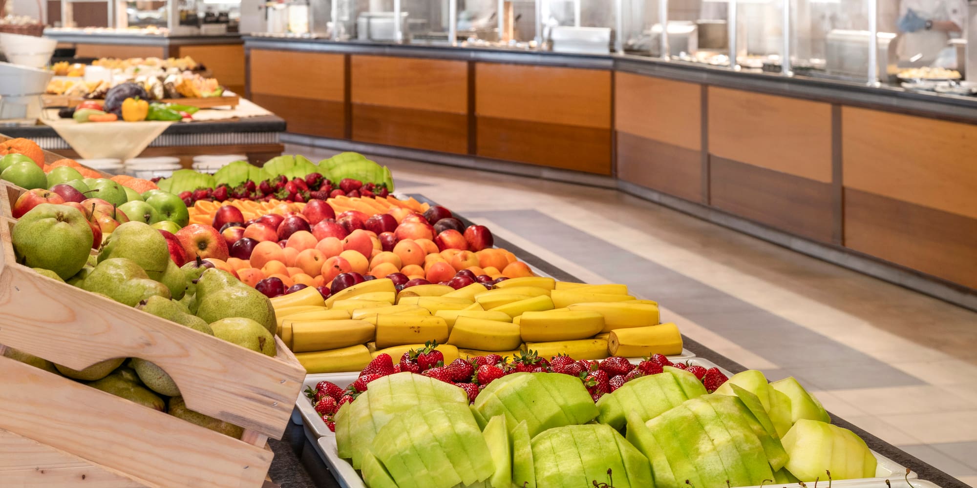 a buffet table full of fruit