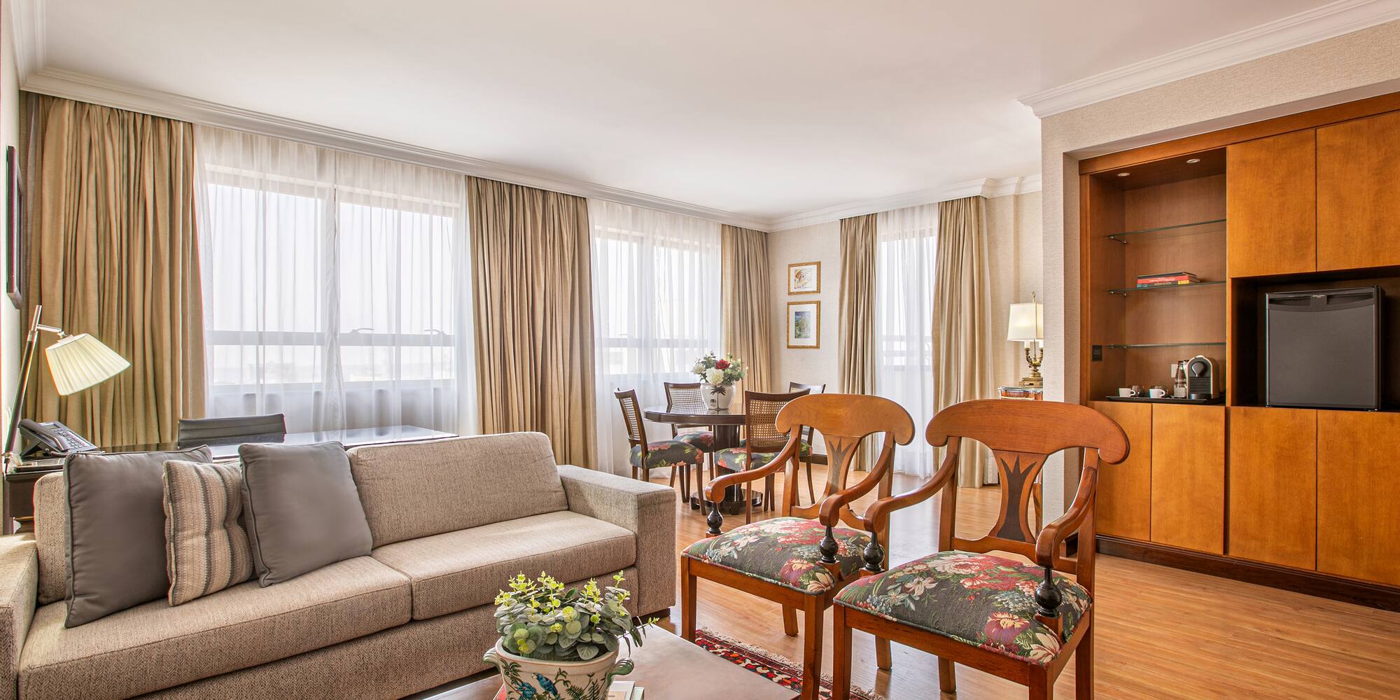 a living room with a couch and chairs