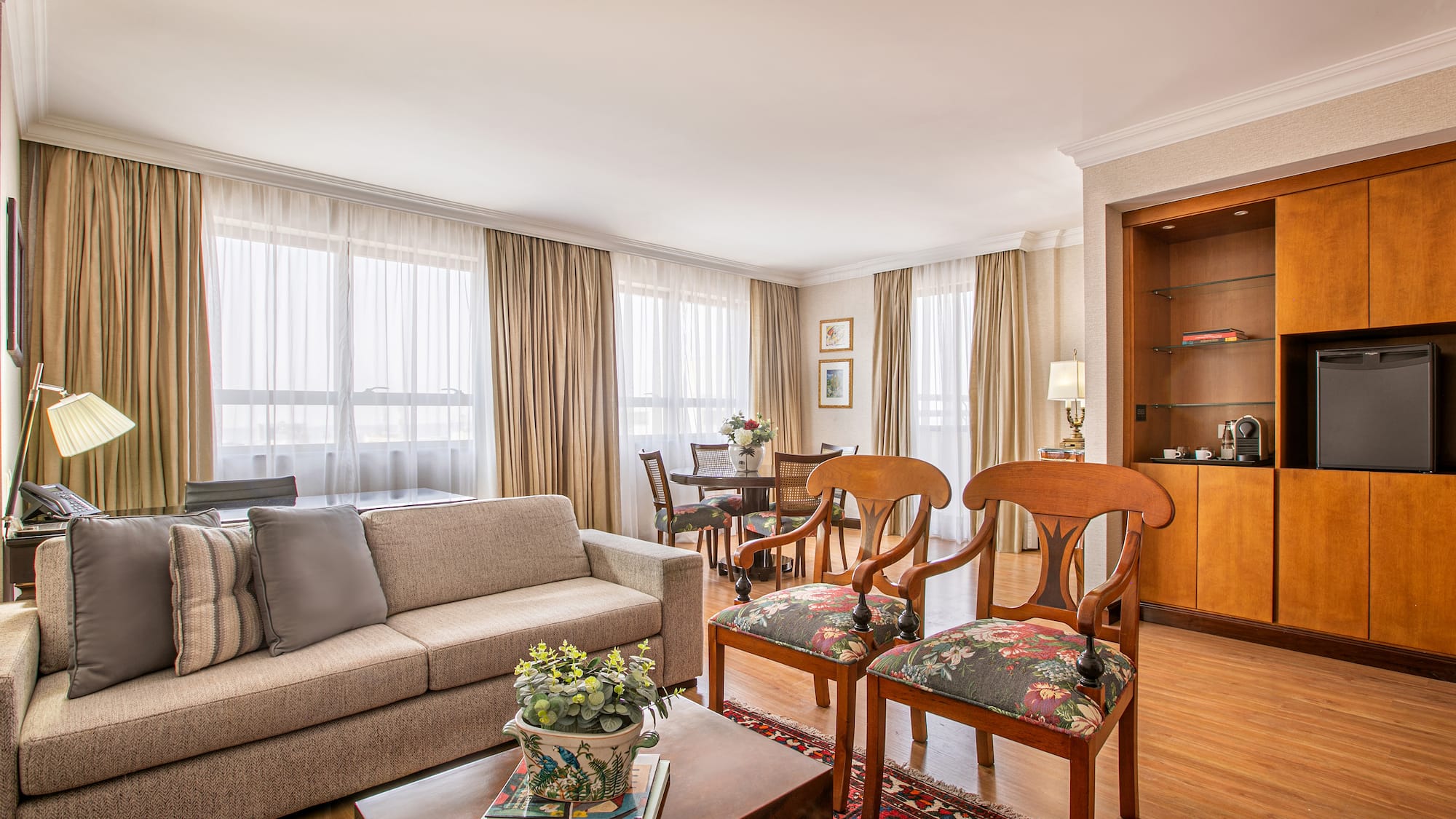 a living room with a couch and chairs