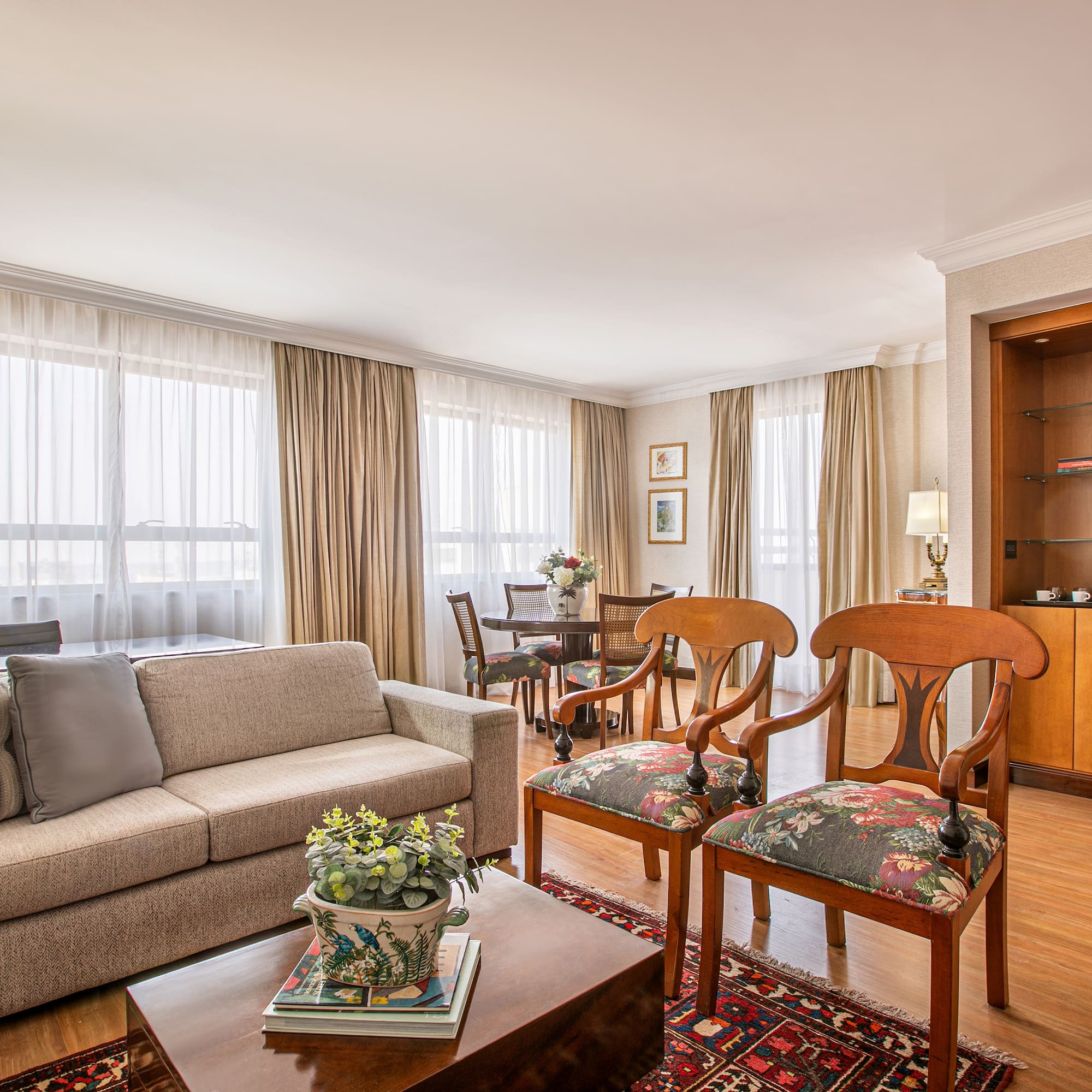 a living room with a couch and chairs