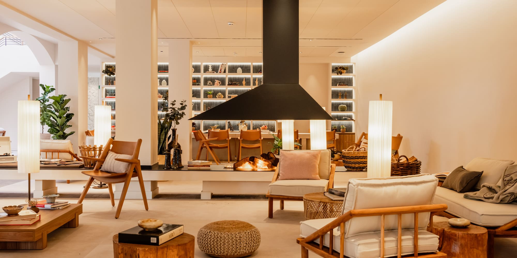 a room with chairs and a fireplace