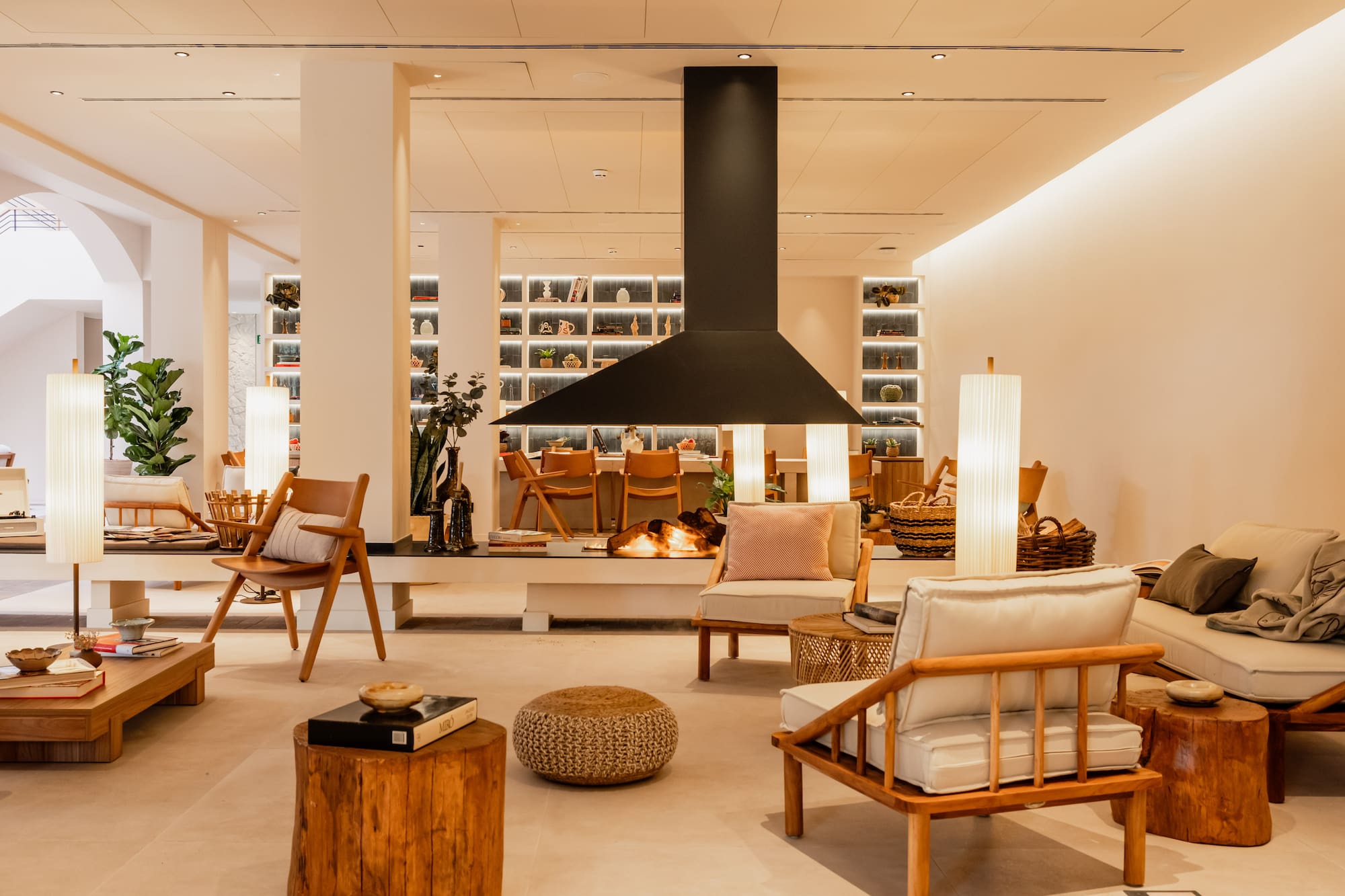 a room with chairs and a fireplace