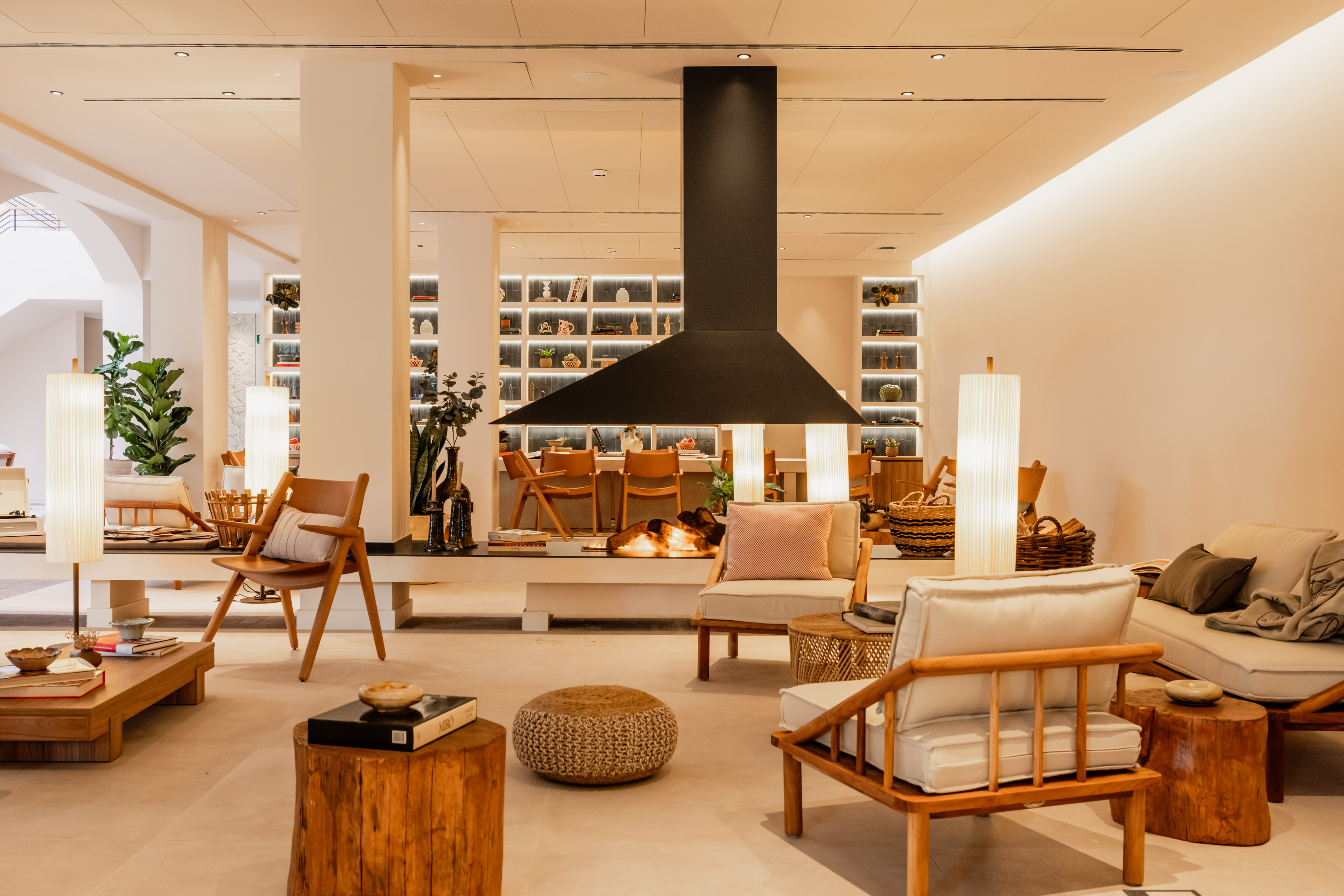 a room with chairs and a fireplace