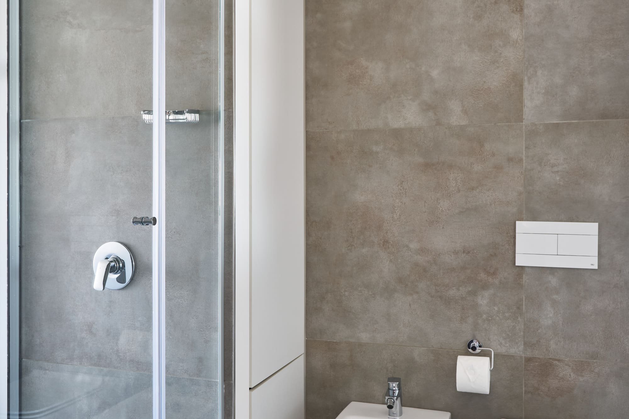 a bathroom with a shower and toilet