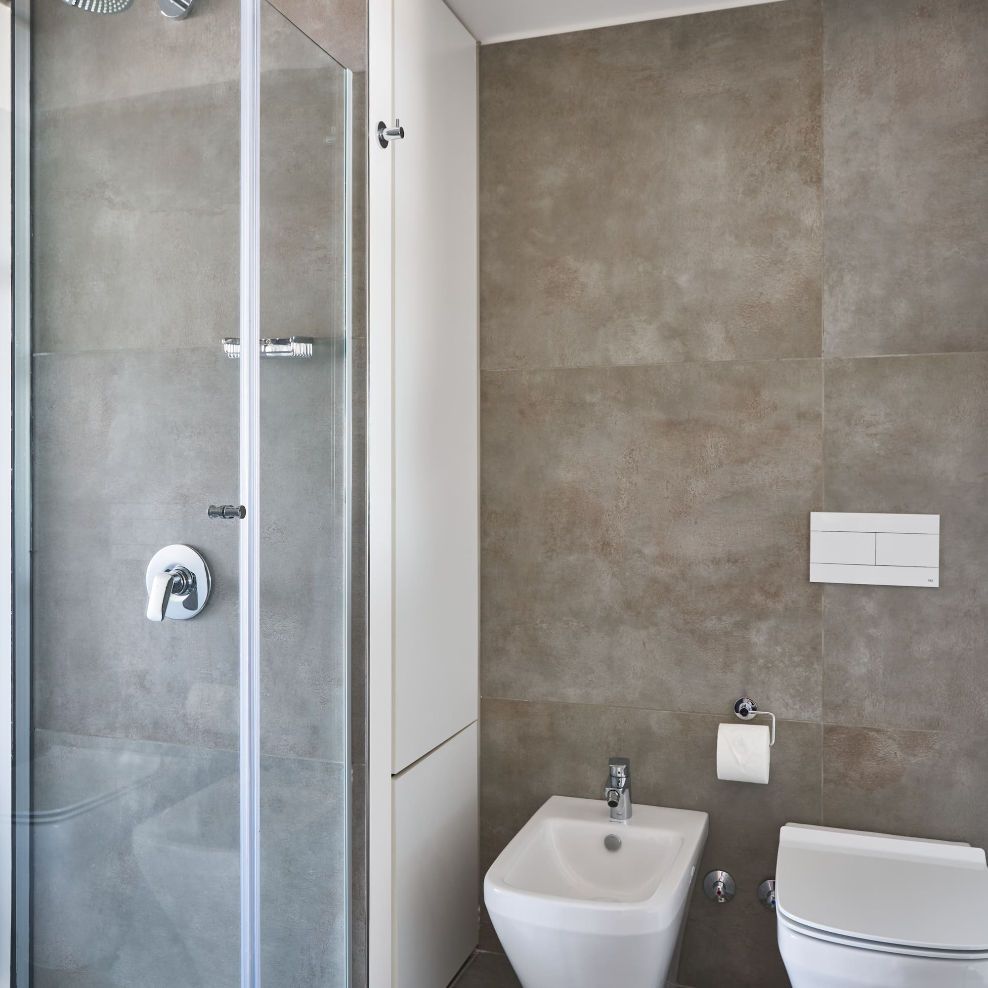 a bathroom with a shower and toilet
