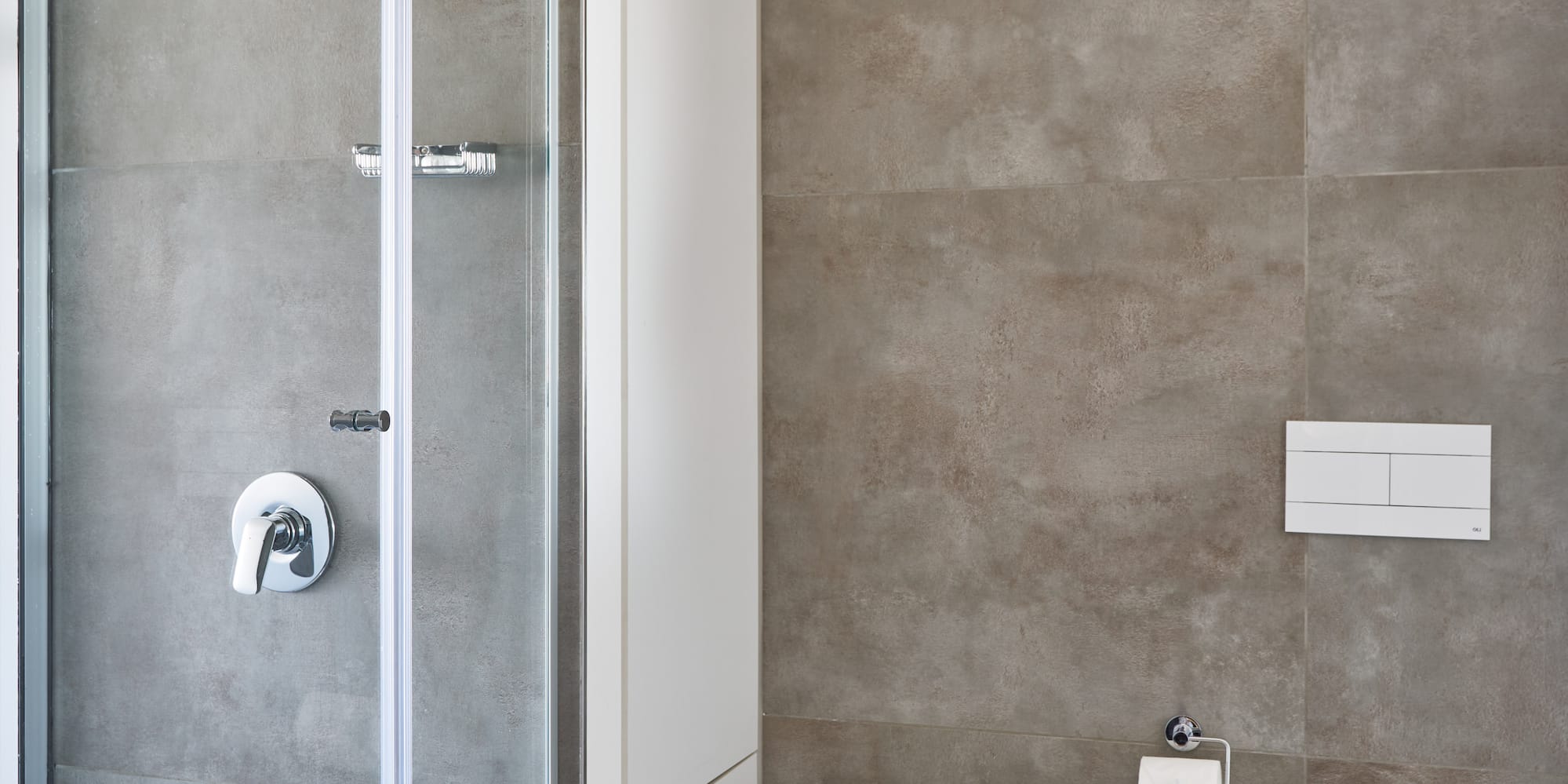 a bathroom with a shower and toilet