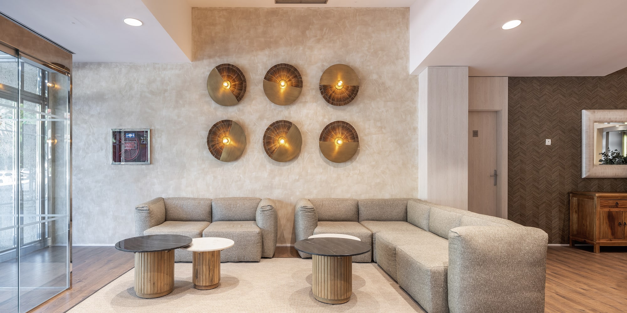 a room with a couch and coffee tables.