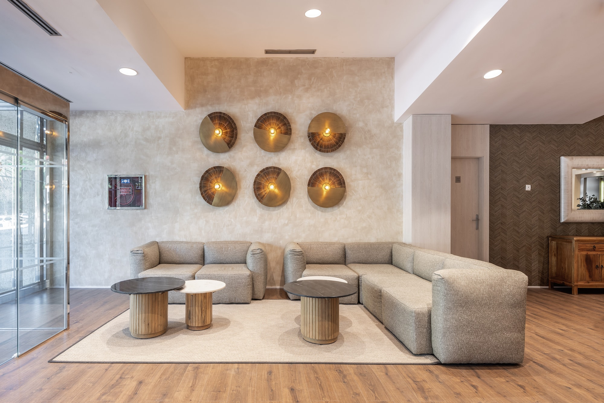 a room with a couch and coffee tables.