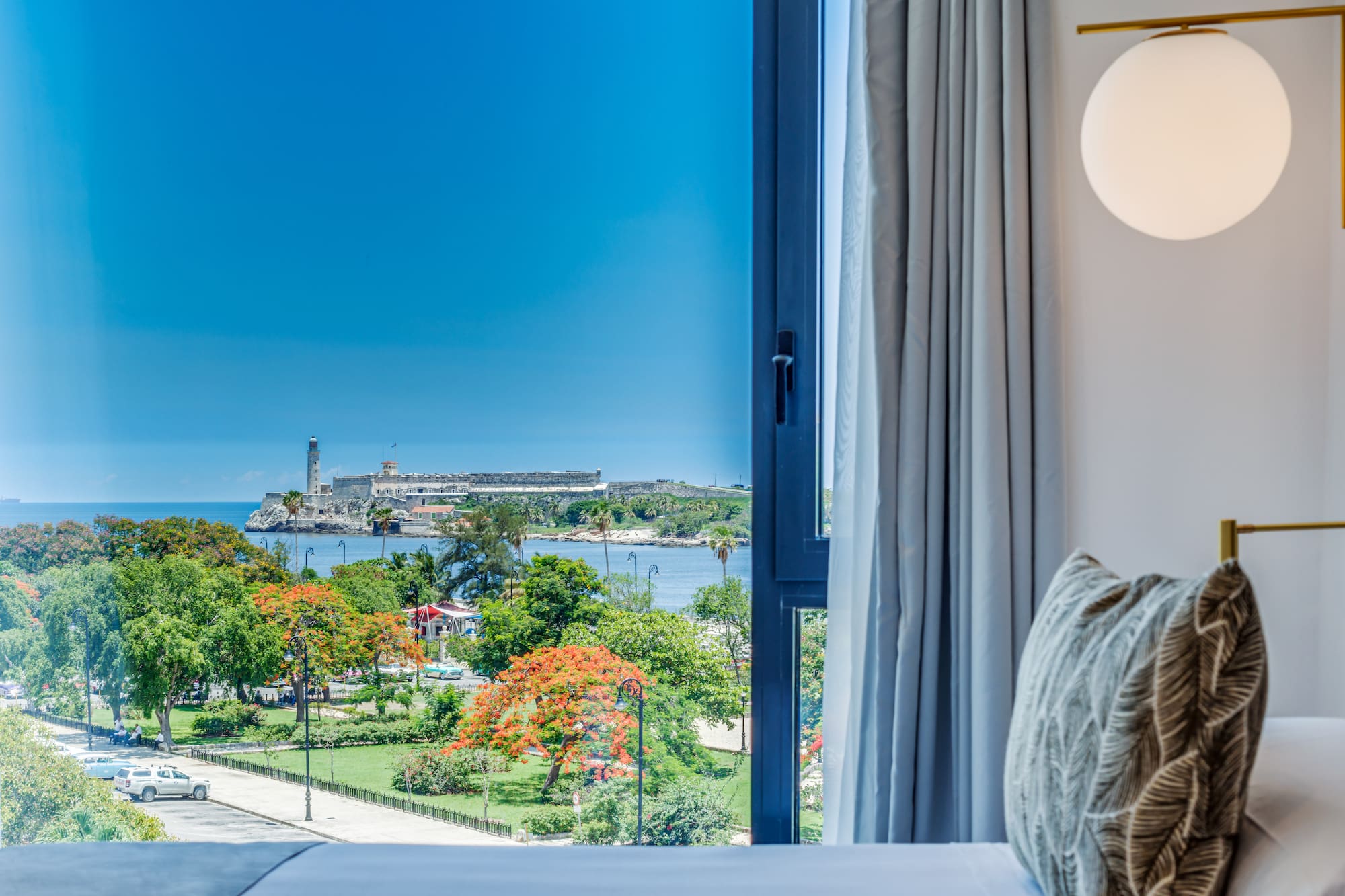 a window with a view of a city and water