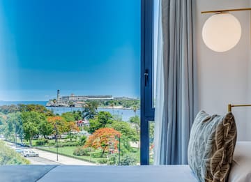 a window with a view of a city and water