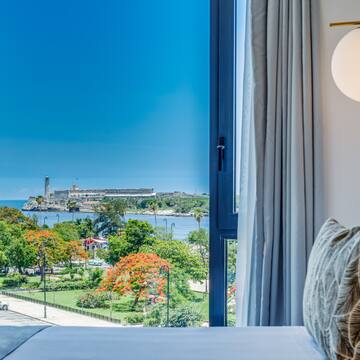 a window with a view of a city and water