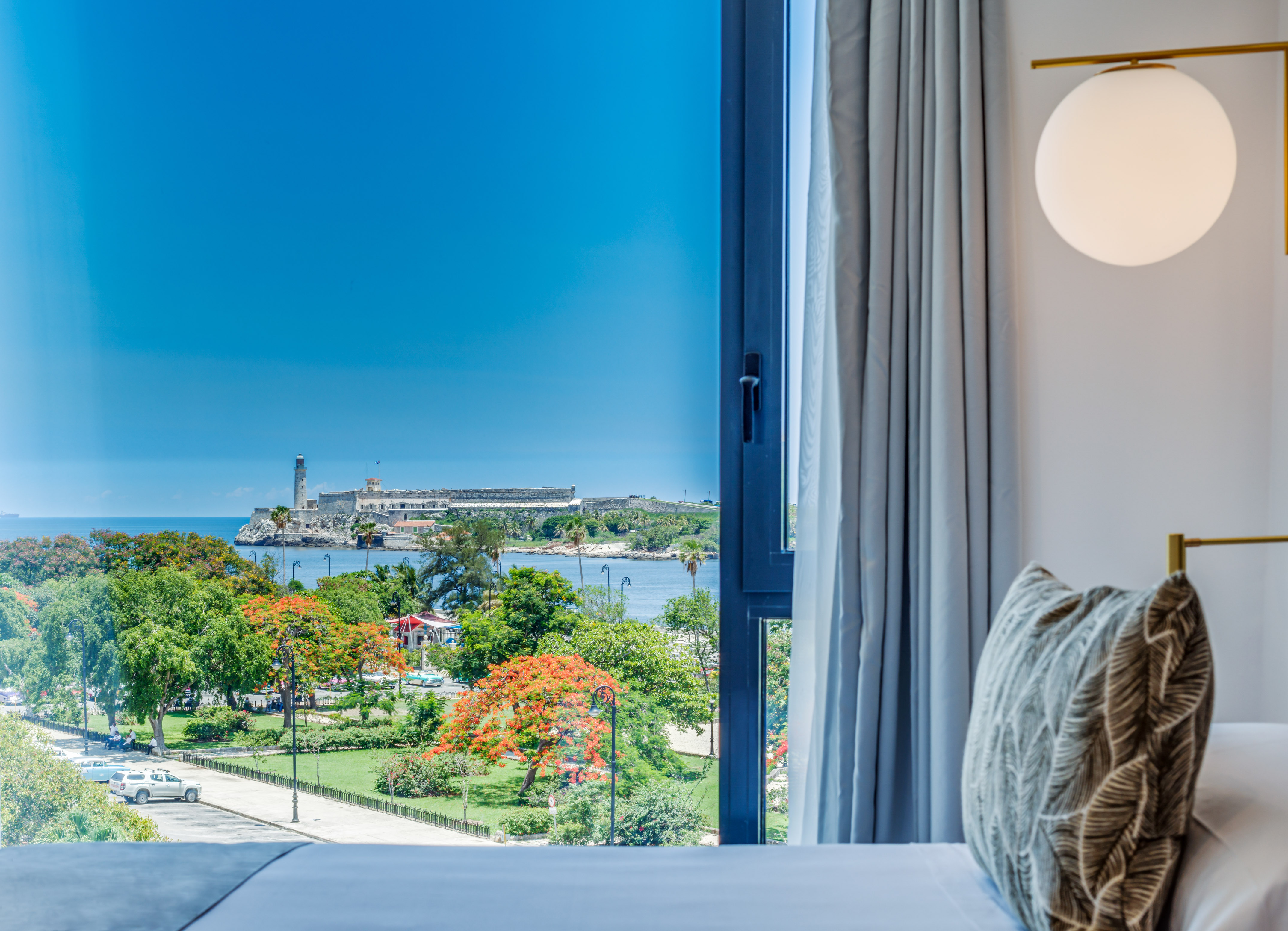 a window with a view of a city and water