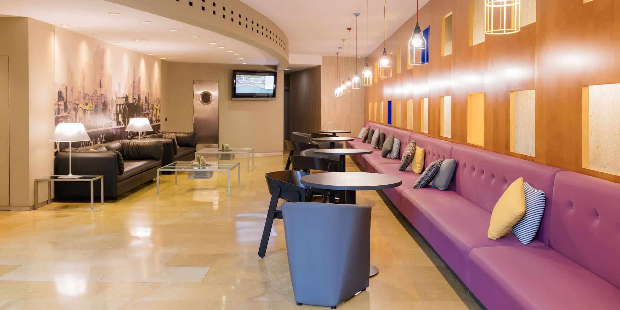 a room with couches and tables