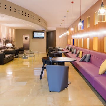 a room with couches and tables