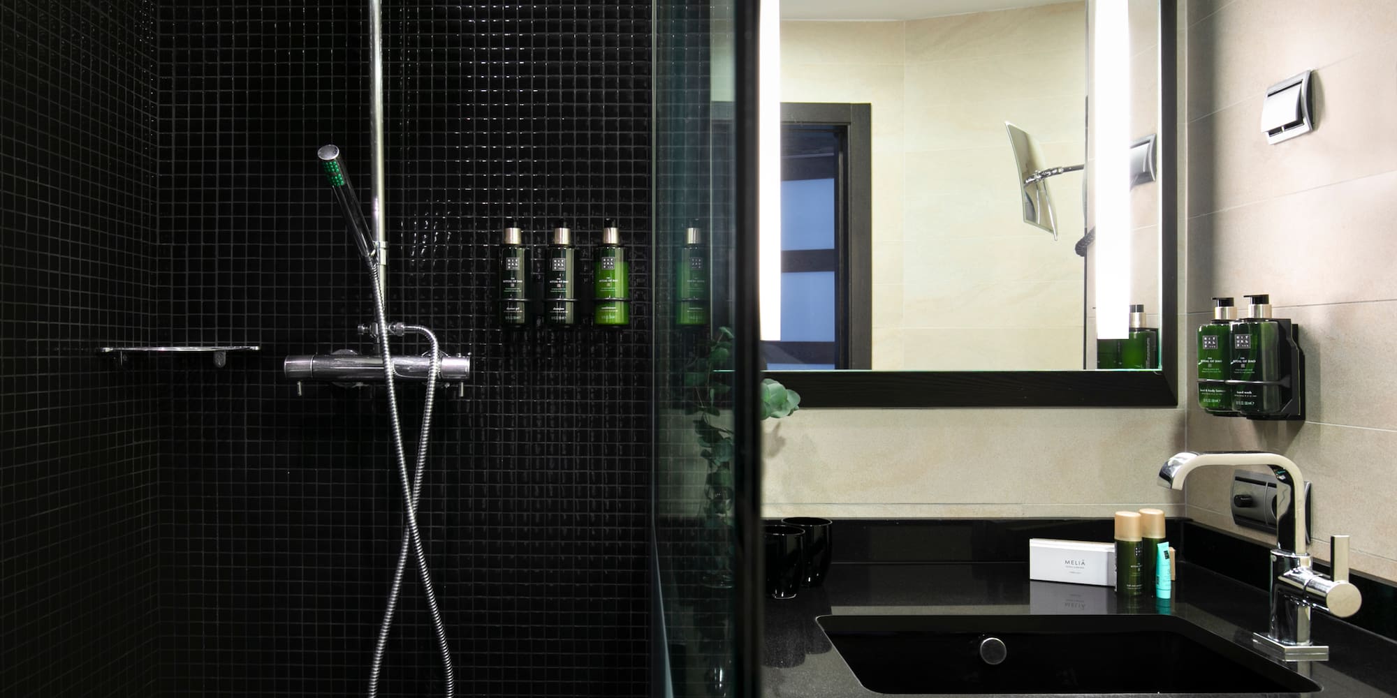 a bathroom with a shower and a sink