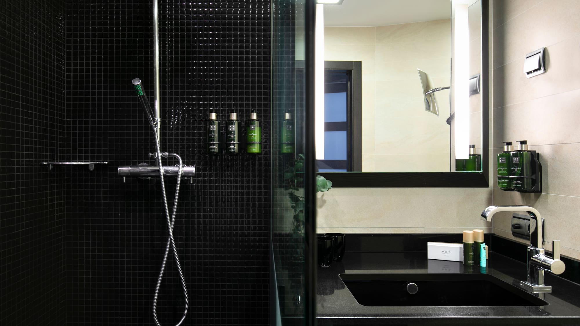 a bathroom with a shower and a sink