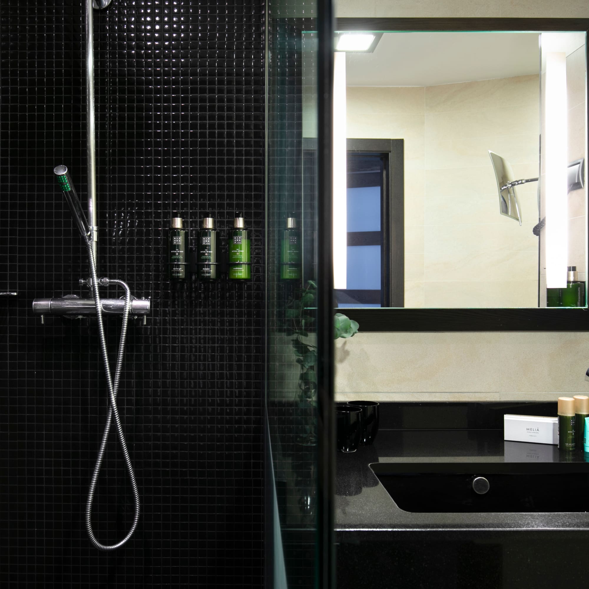 a bathroom with a shower and a sink