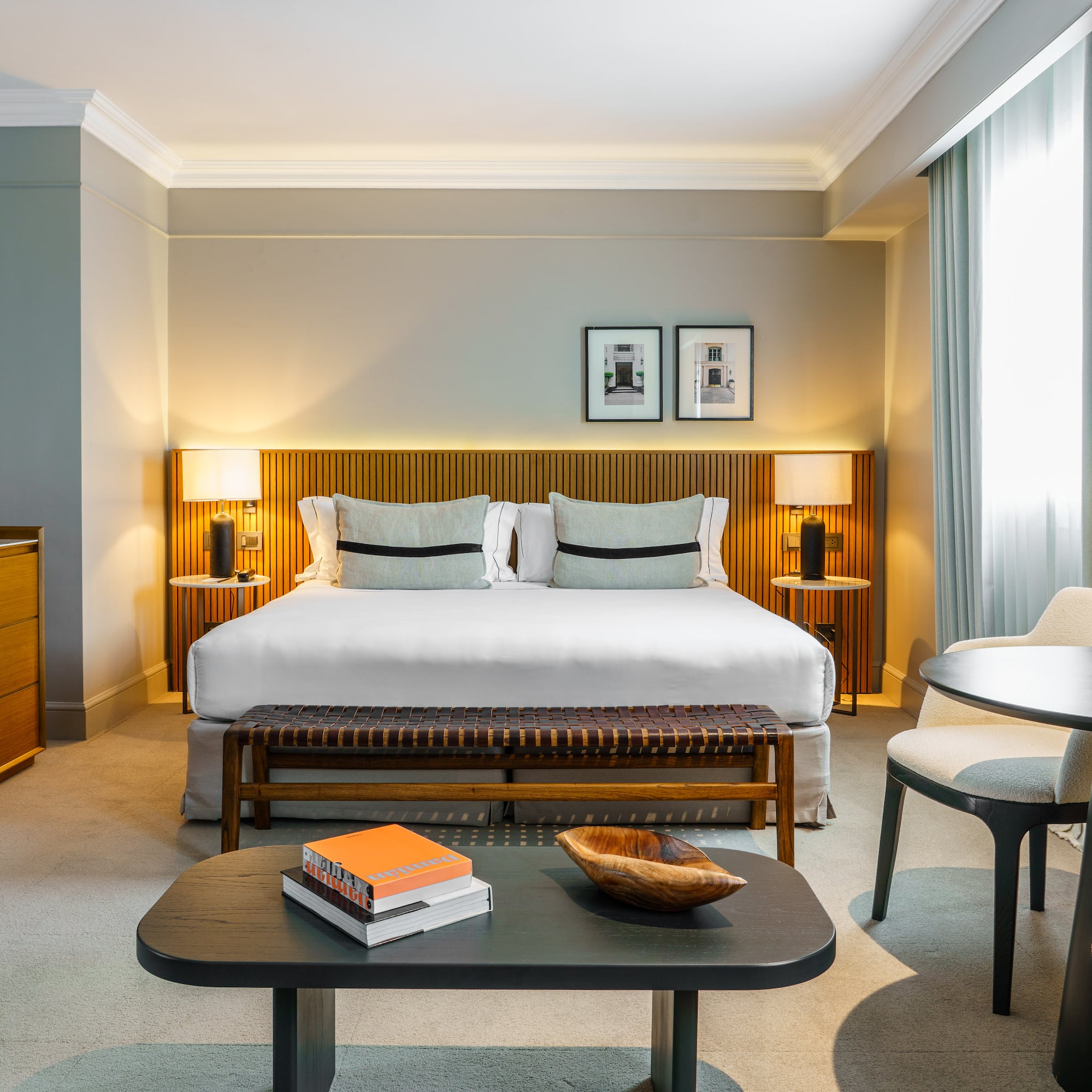 a bedroom with a bed and a table