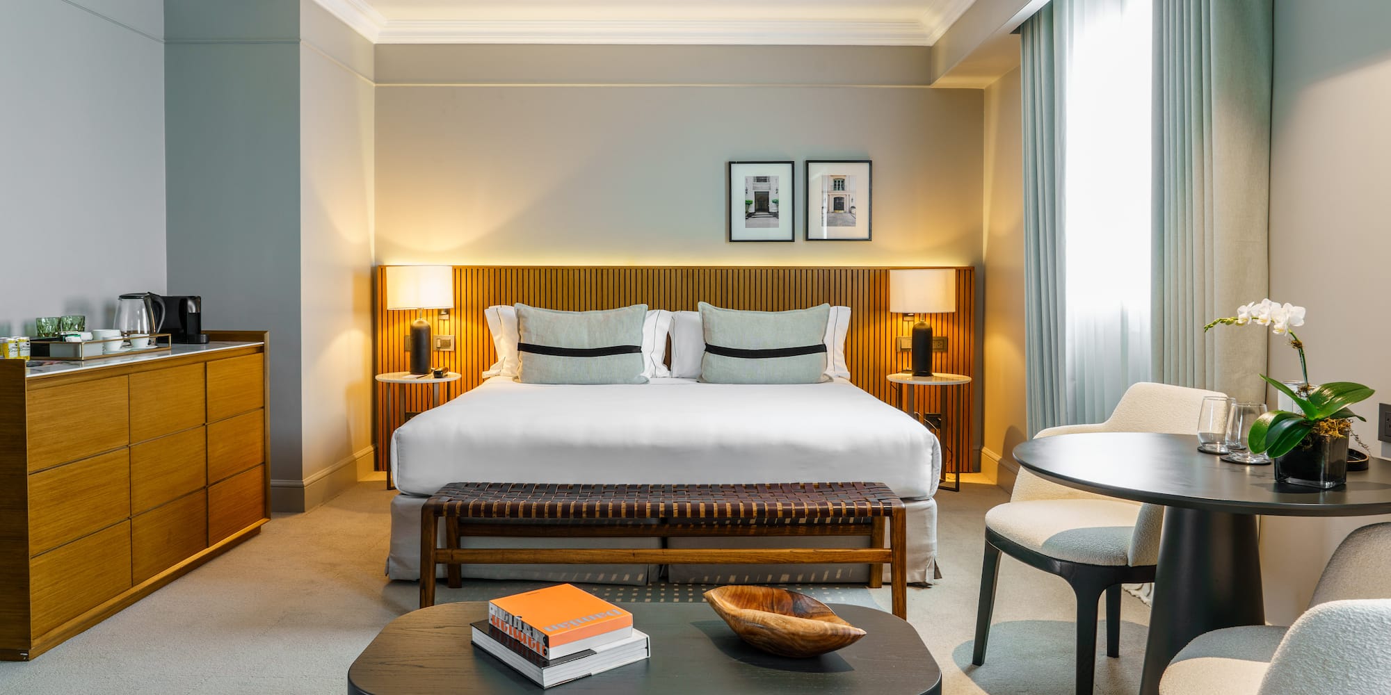 a bedroom with a bed and a table