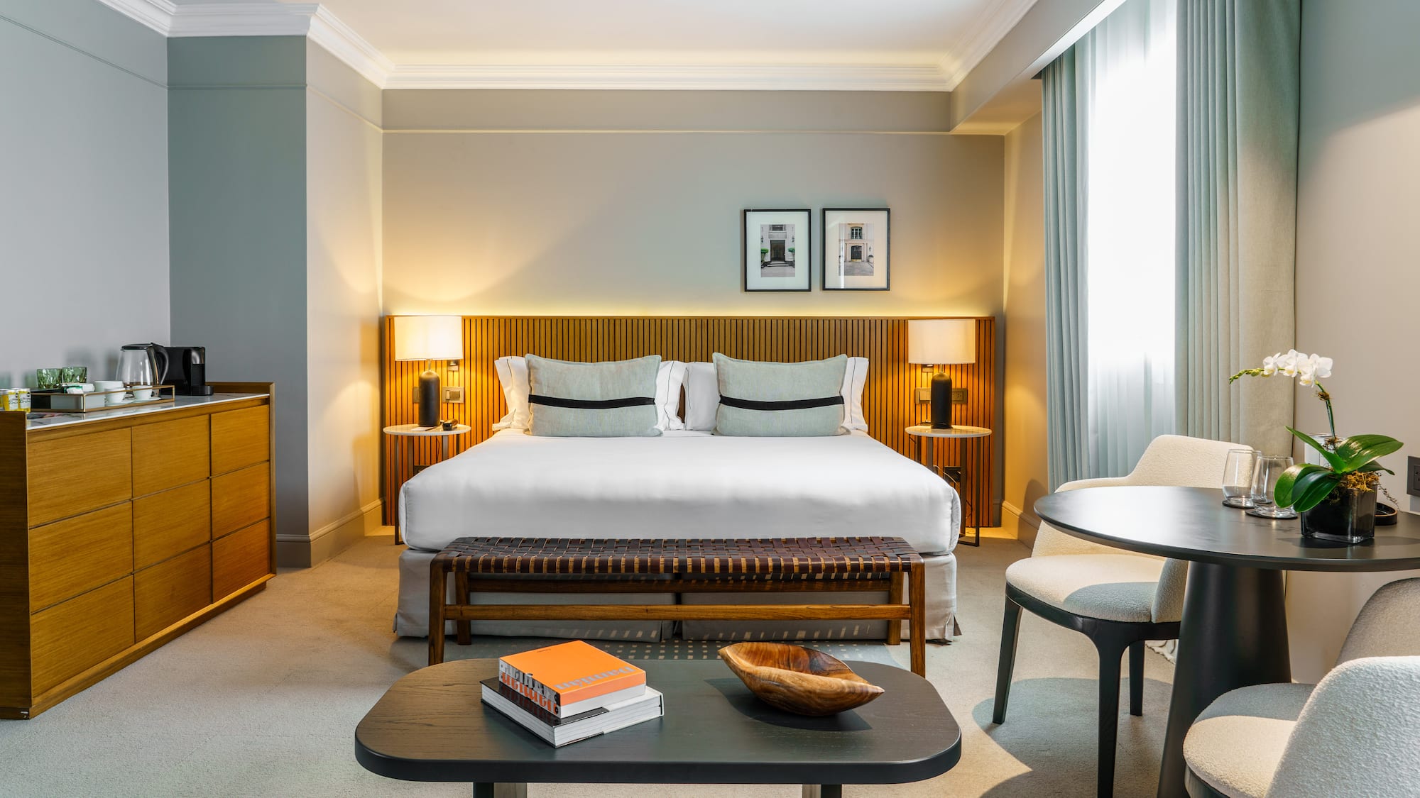 a bedroom with a bed and a table