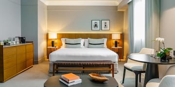 a bedroom with a bed and a table