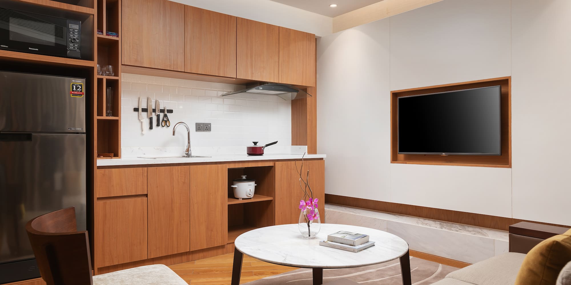a living room with a tv and a table