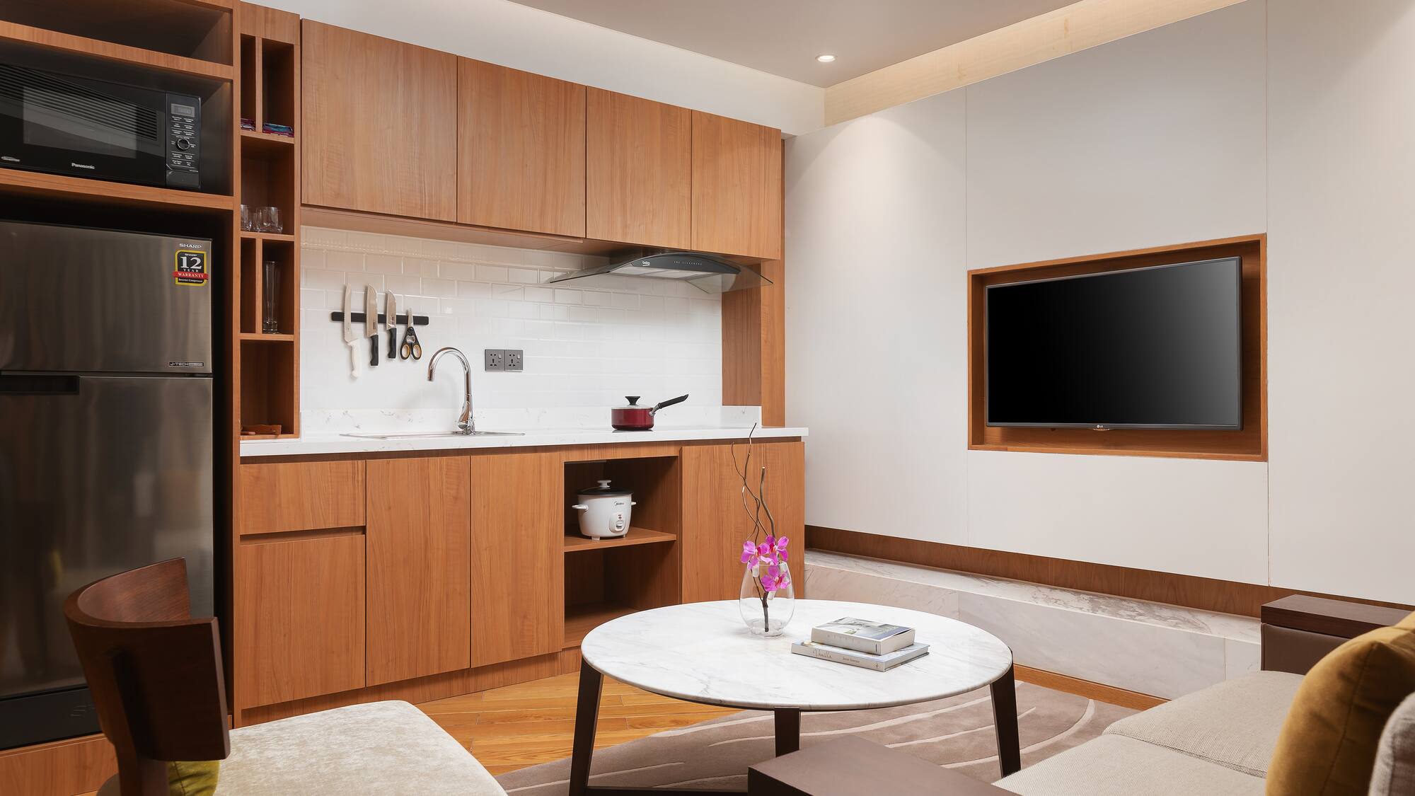 a living room with a tv and a table