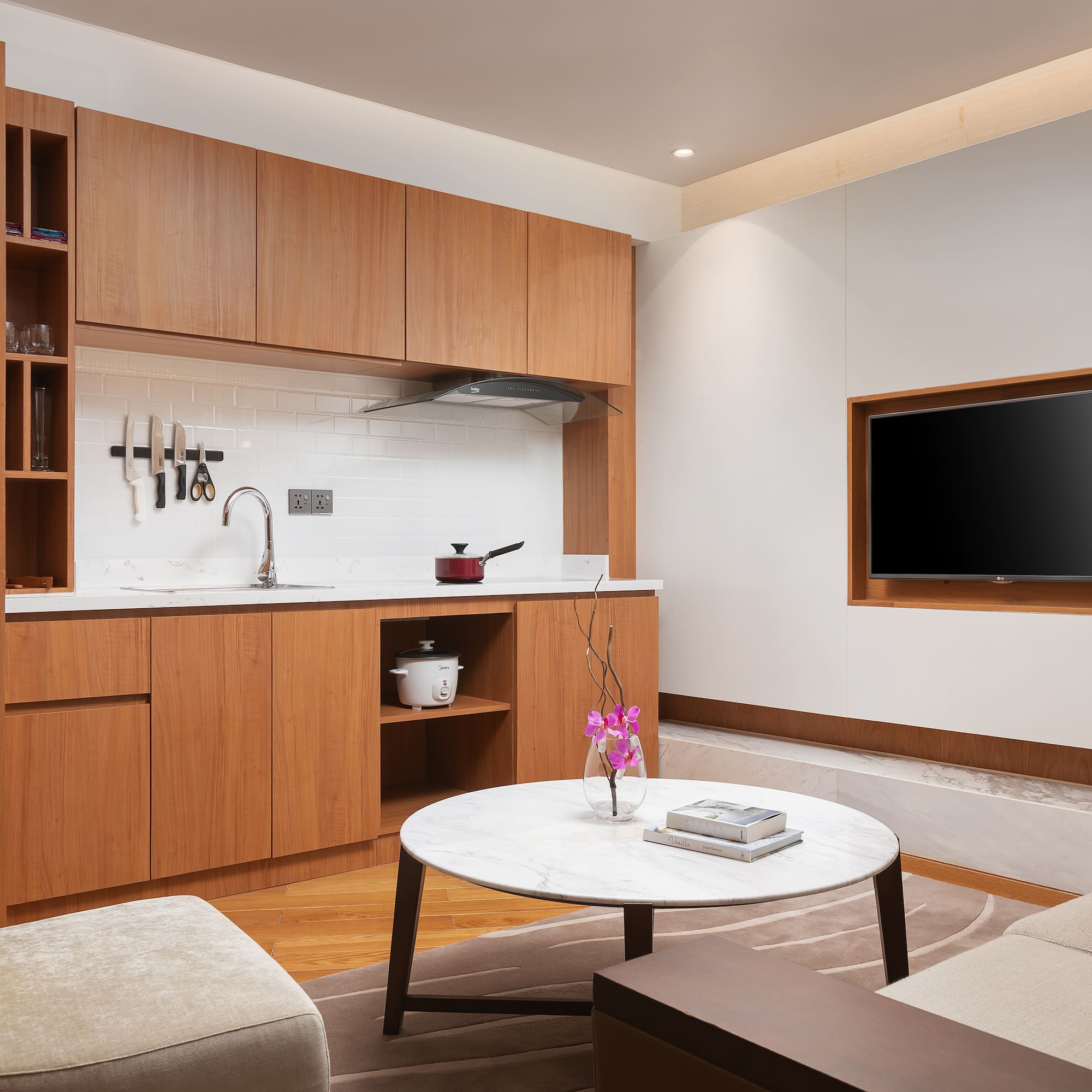 a living room with a tv and a table