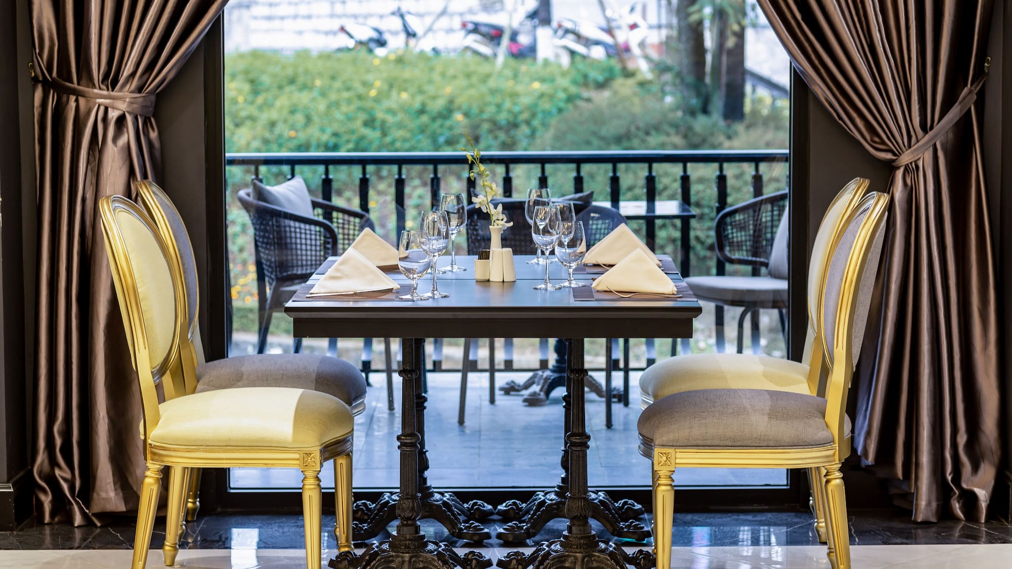 a table with chairs and a curtain