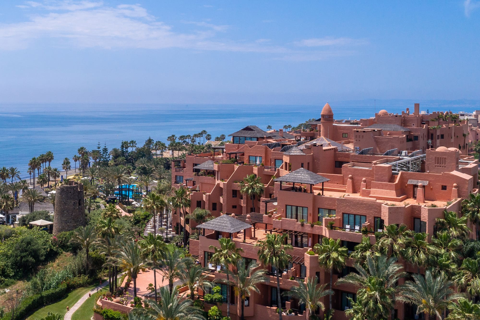 a large building with many windows and a body of water