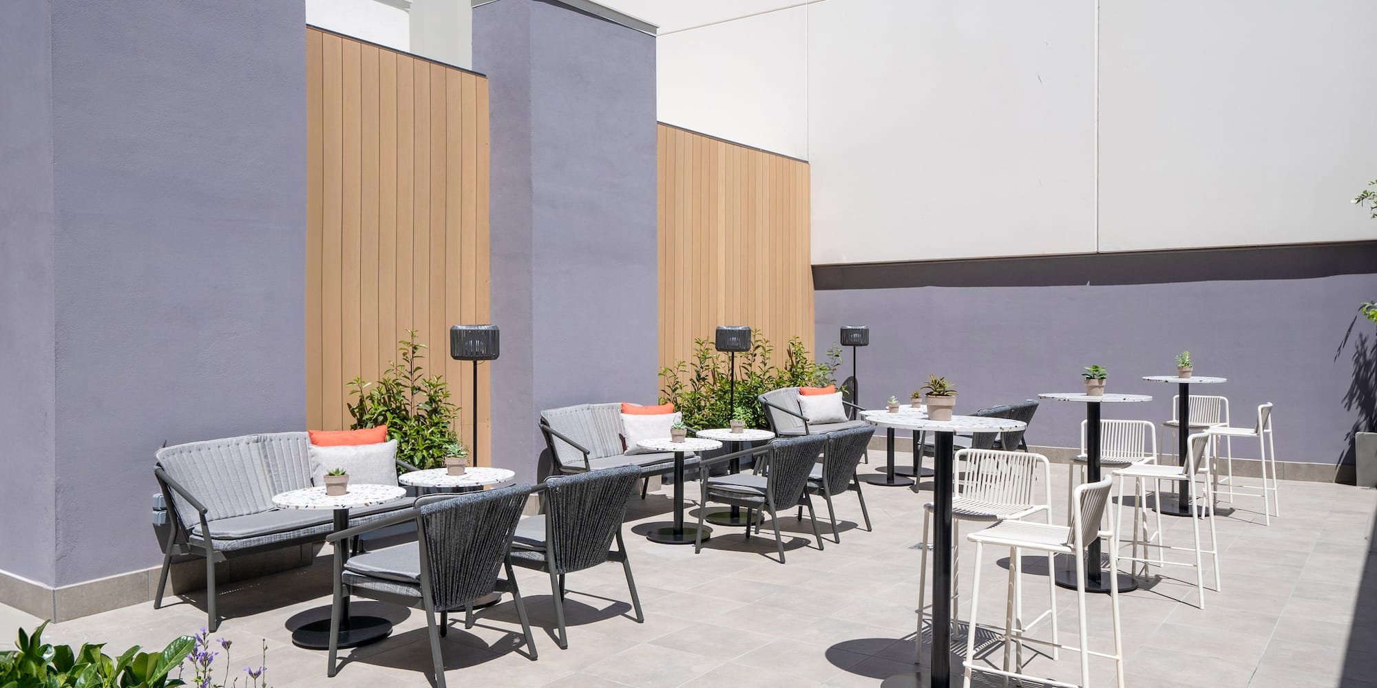 a patio with chairs and tables