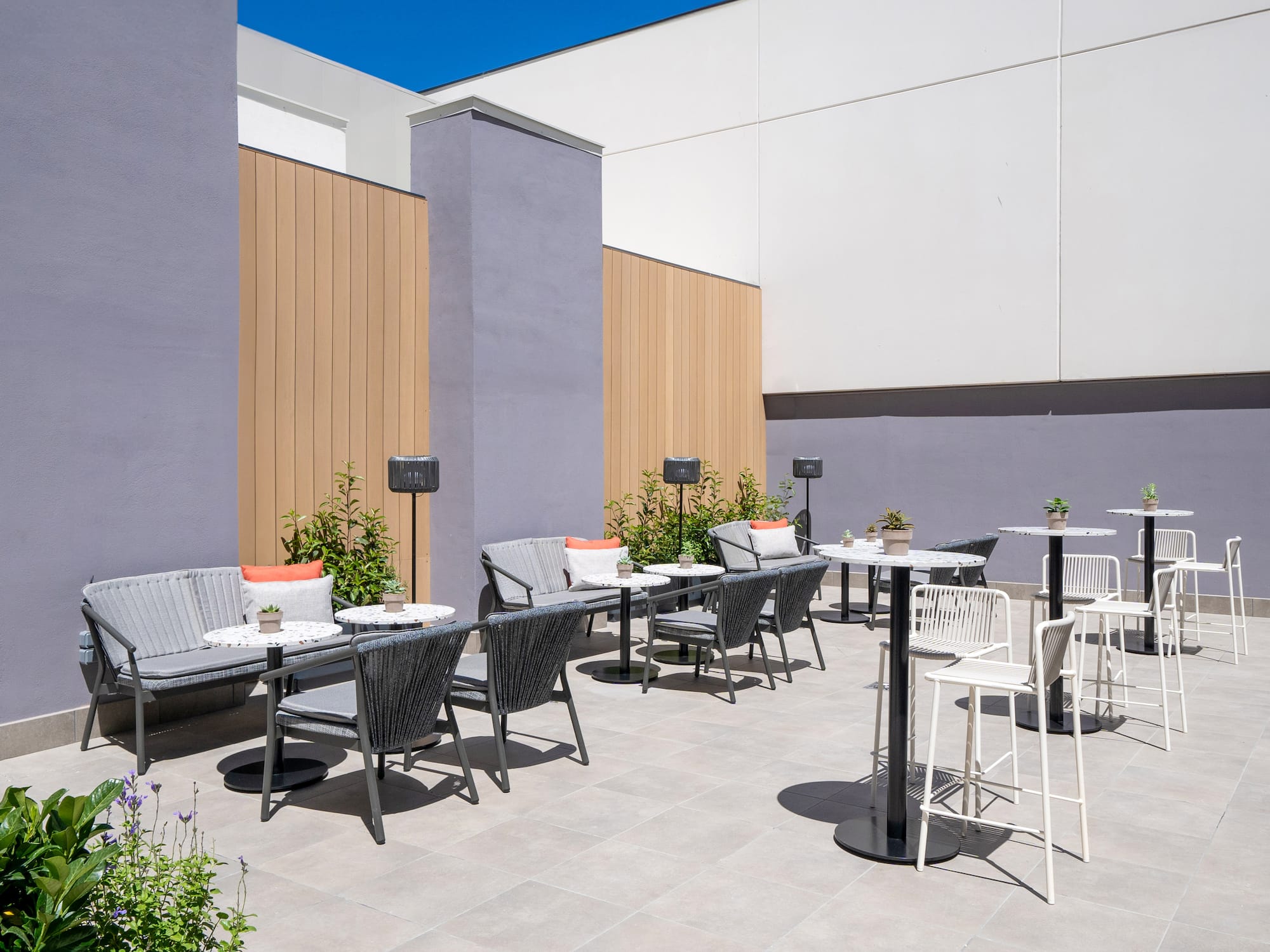 a patio with chairs and tables
