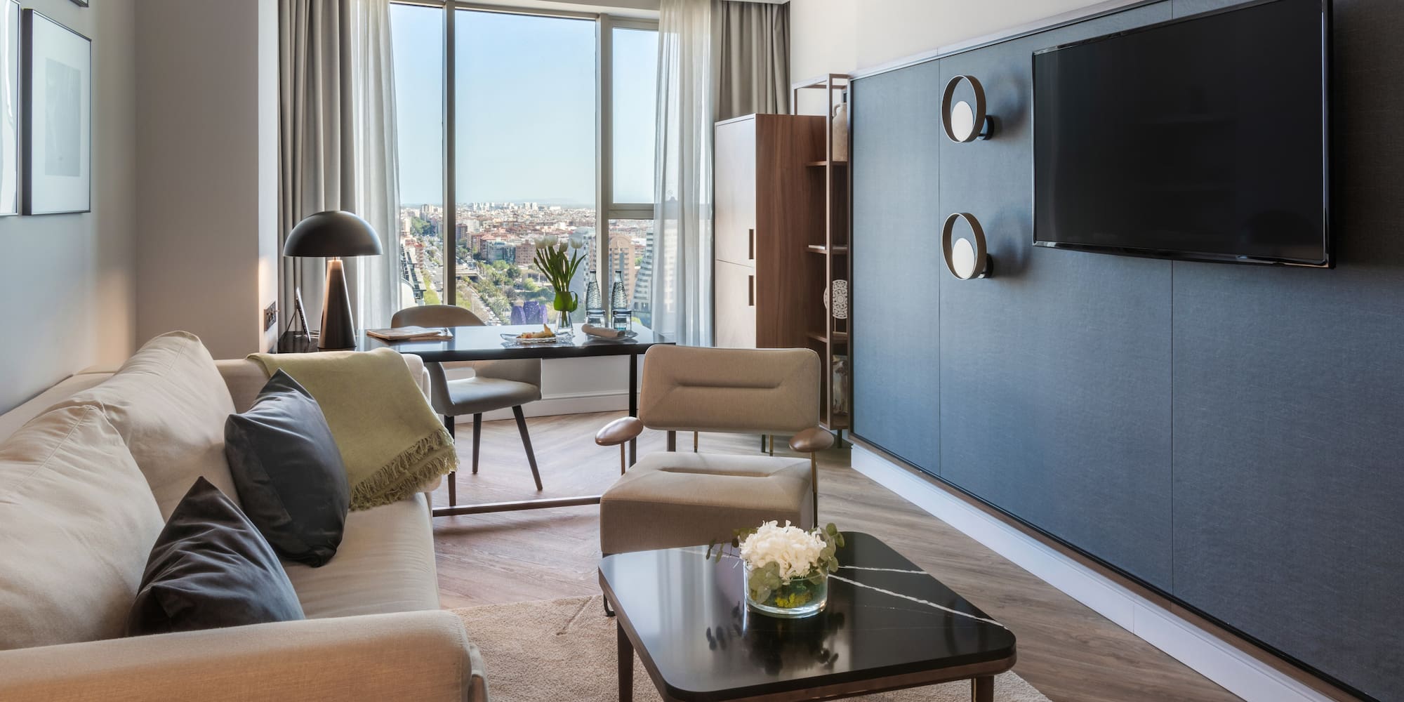 a living room with a tv and a table