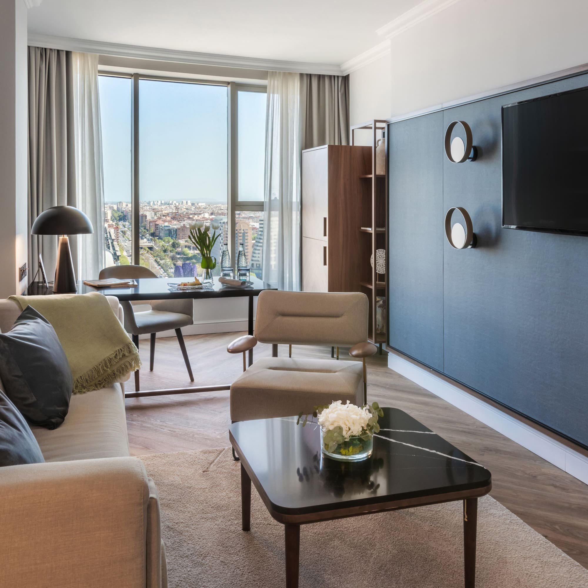 a living room with a tv and a table