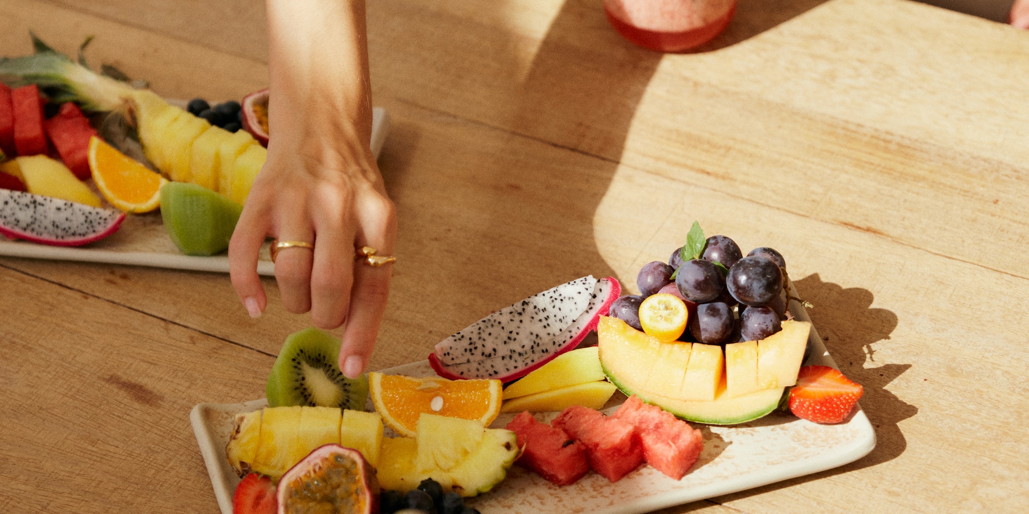 a group of people eating fruit