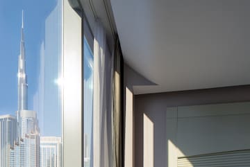 a room with a window and a city skyline