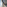Modern room window view of Dubai's Burj Khalifa with bright sunlight.