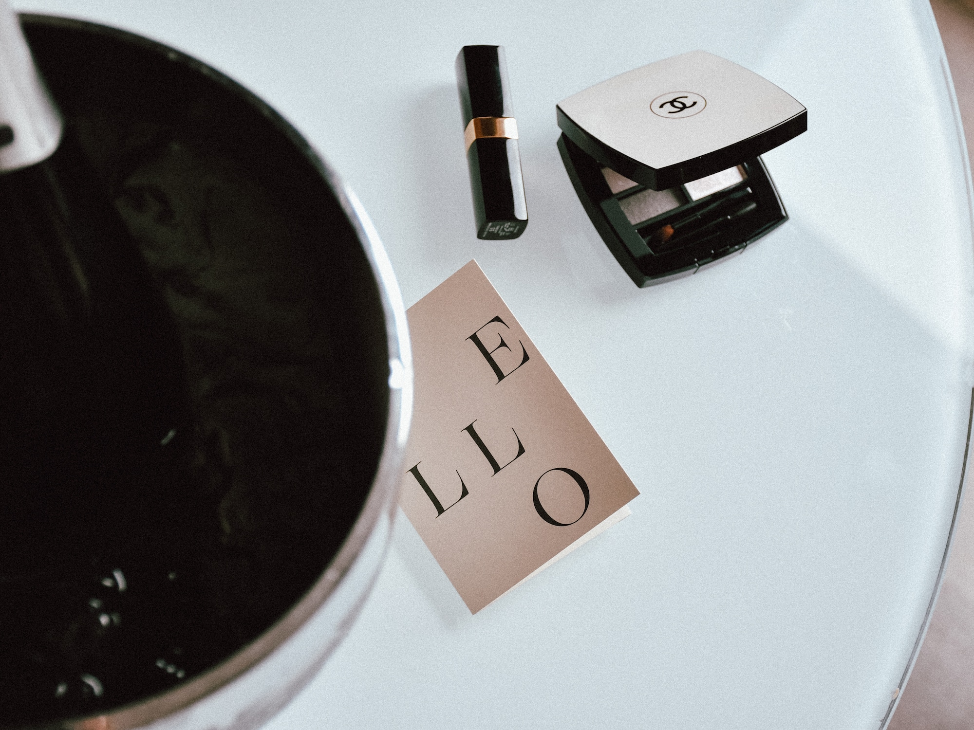 a lipstick and a box of makeup