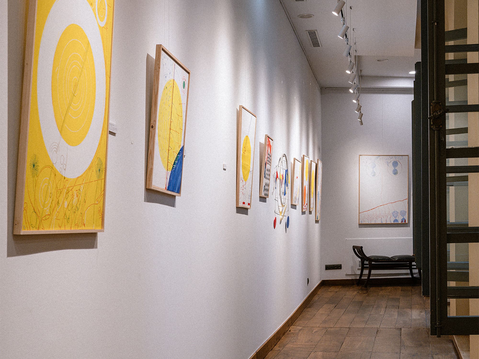 a hallway with art on the wall