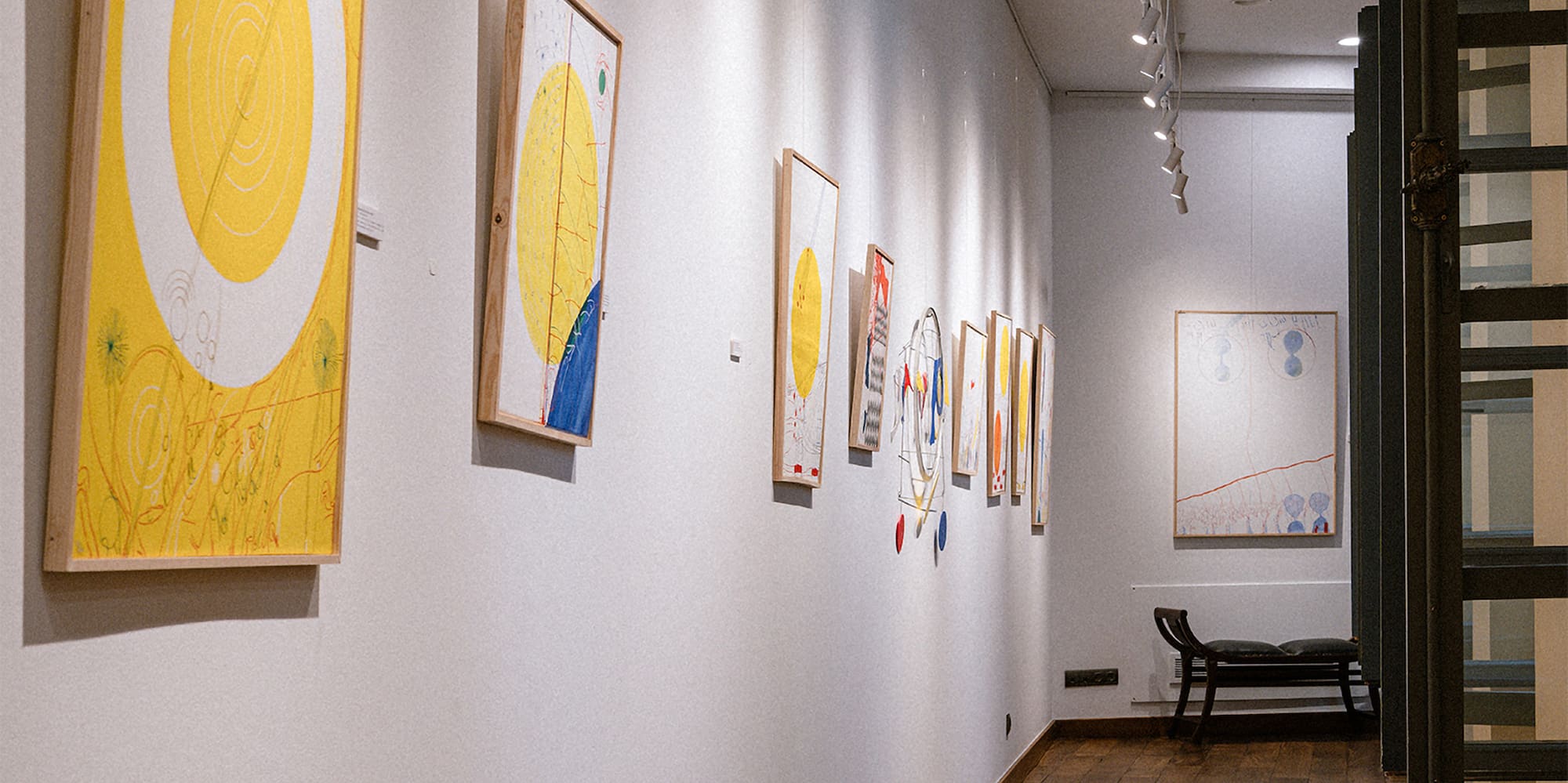 a hallway with art on the wall