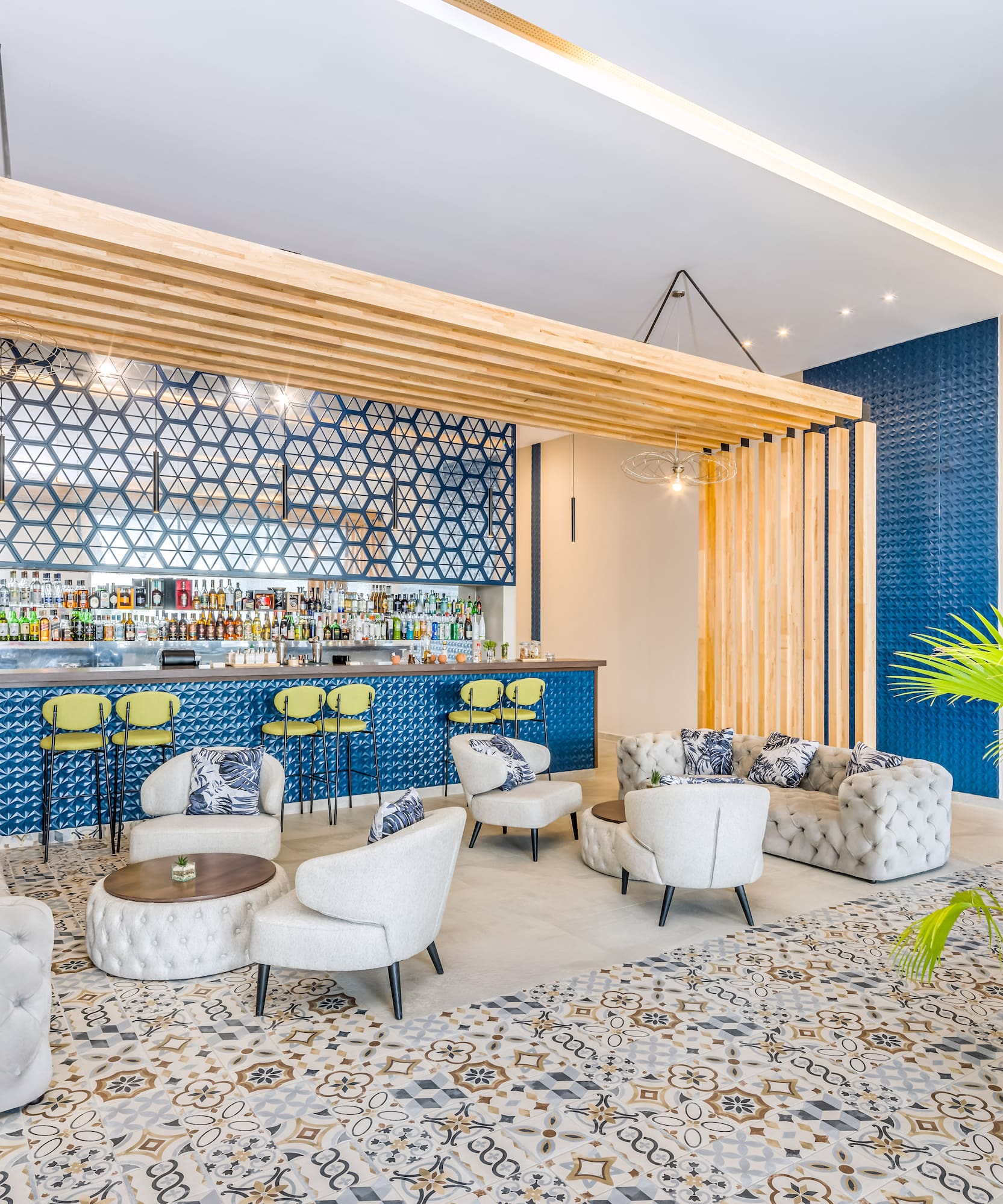 a room with a bar and chairs