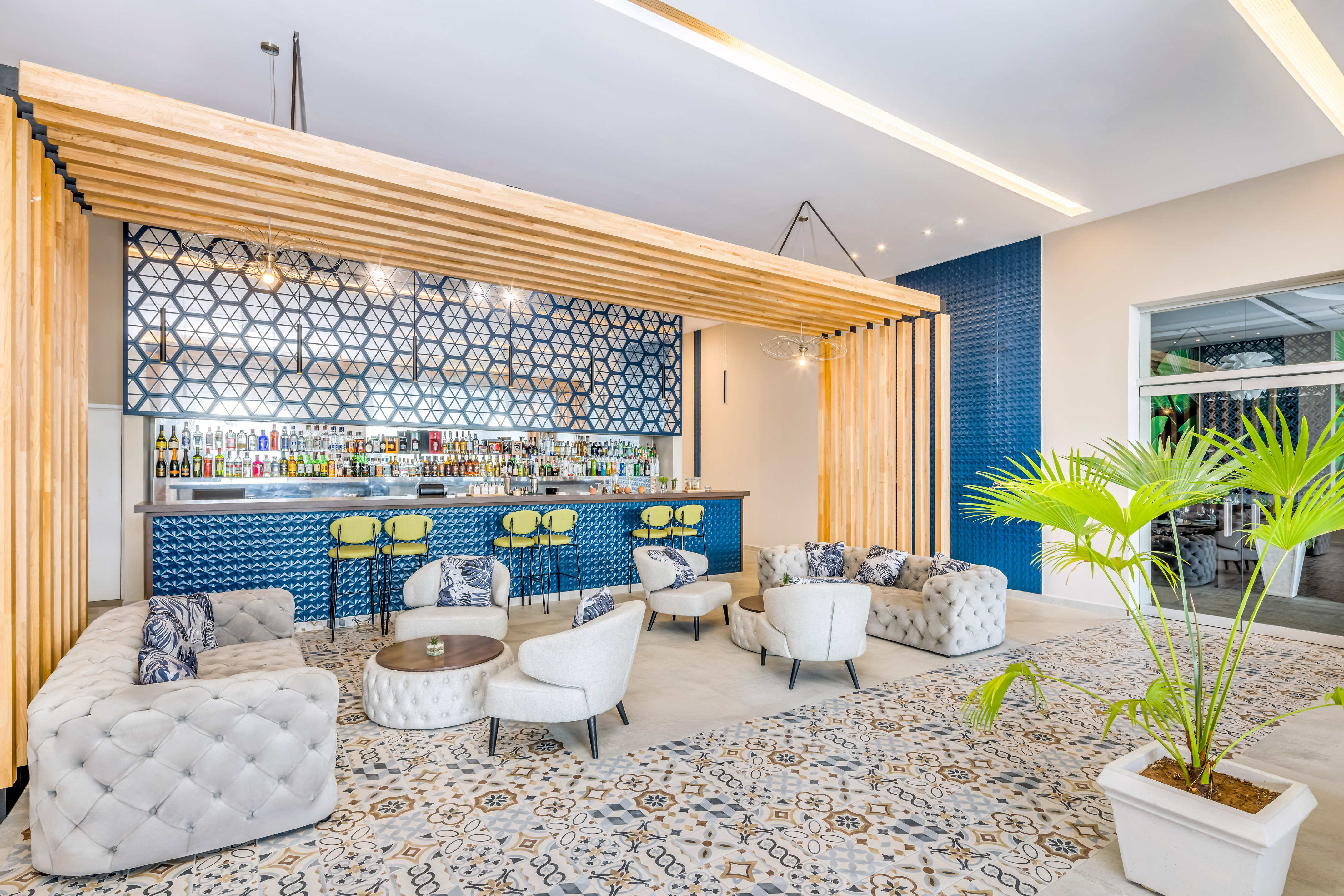 a room with a bar and chairs