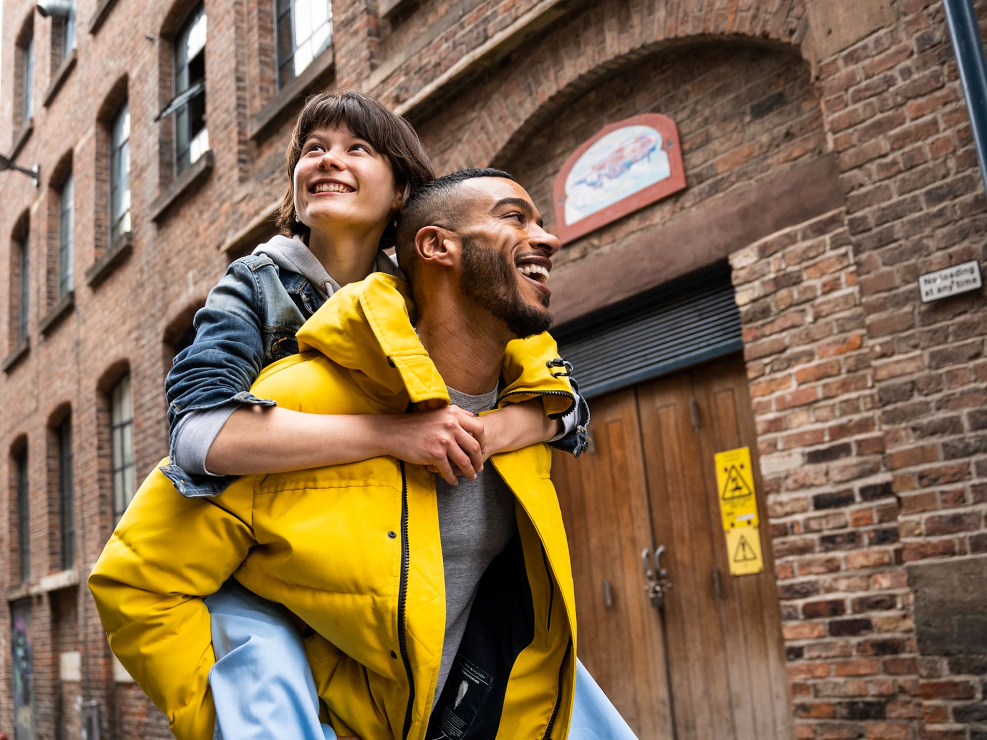 a man carrying a woman on his back