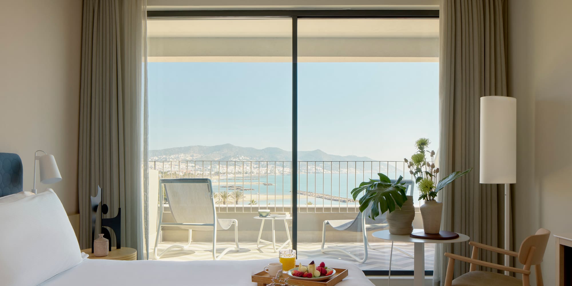 a room with a bed and a table with chairs and a table with chairs and a table with chairs and a table with chairs and a table with chairs and a table with chairs and a table with